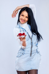 Portrait of beautiful woman posing on white background with glas