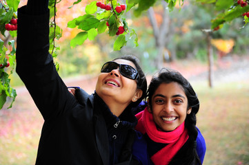 Loving mother and daughter enjoying autumn