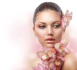 Wall Mural - beautiful girl with orchid flowers. perfect make-up