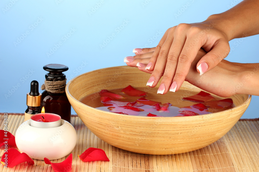 spa treatments for female hands,  on blue background