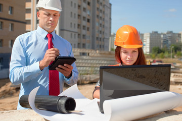 Wall Mural - Two architects  works in front of building site