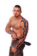 A topless male with a knife