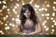 Sexy beautiful young girl in casino on the background bokeh