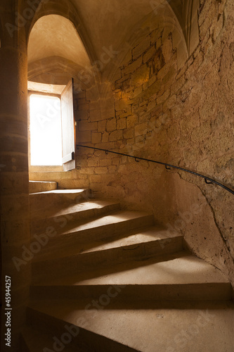 Naklejka na drzwi Spiral staircase in stone