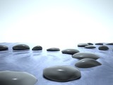 Fototapeta Desenie - Zen stones in water, blue sky