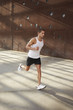 © bonninturina - young man running on the street