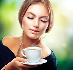 Wall Mural - Beautiful Girl Drinking Tea or Coffee