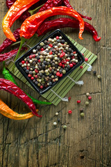 Canvas Print - Peppercorn mix on a vintage wooden table