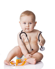 Wall Mural - Sweet baby with stethoscope and measure tape on a white backgrou