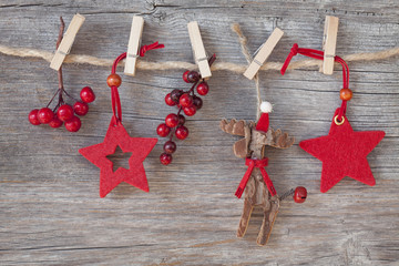 Wall Mural - Wooden christmas deer and red stars