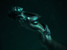 Artistic Nude Of Woman Shiny Blue Skin