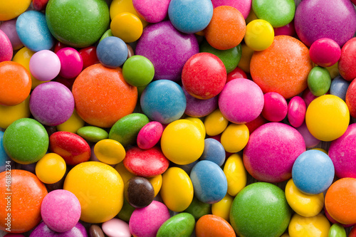 Plakat Three different sizes of colorful candies