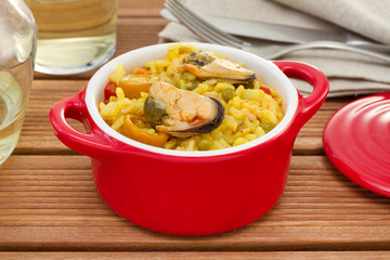 rice with seafood in red bowl