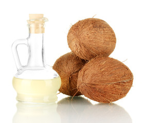 Wall Mural - decanter with coconut oil and coconuts isolated on white