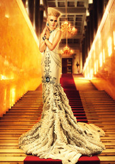 blond woman in long white dress on red carpet