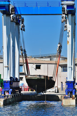 Crane lifts a boat