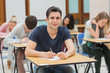© WavebreakMediaMicro - Man looking up from exam and smiling