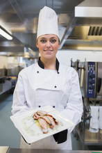 Smiling Chef Showing Her Plate
