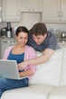 © WavebreakMediaMicro - Young couple using the laptop