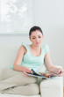 © WavebreakmediaMicro - Reading woman sitting on the couch