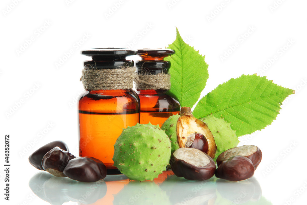 medicine bottles with chestnuts and leaves, isolated on white