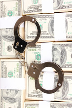 Handcuffs On The Packs Of Dollars Close-up