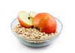 Oats and apple halves in transparent bowl