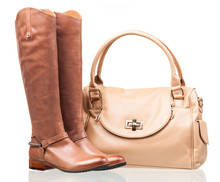 Women Knee-high Boots And Leather Bag Over White
