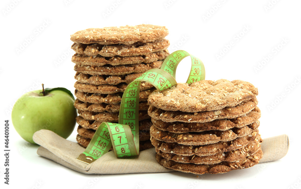 tasty crispbread, apple and measuring tape, isolated on white
