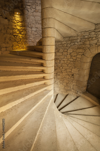 Naklejka na drzwi Spiral staircase in stone