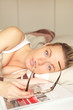 Sick woman relaxing in bed