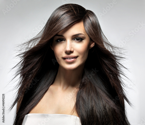 Naklejka na szafę Fashion model with long straight hair.