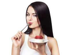 Woman Licking Spoon With Cake