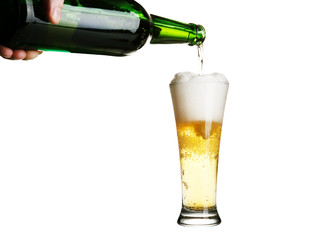 Beer pouring from green bottle into glass isolated on white