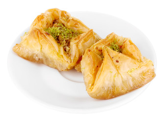Wall Mural - Sweet baklava on plate isolated on white