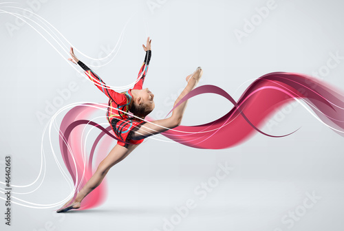 Naklejka ścienna Young woman in gymnast suit posing