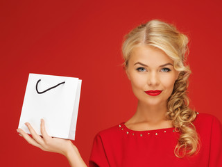 lovely woman in red dress with shopping bag