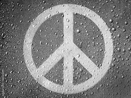 Naklejka dekoracyjna Peace symbol painted on metal surface covered with rain drops
