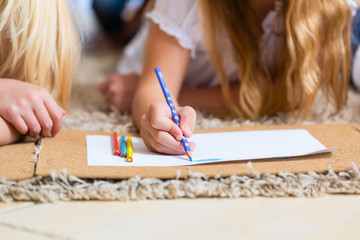 Wall Mural - Family at home, the children coloring on floor