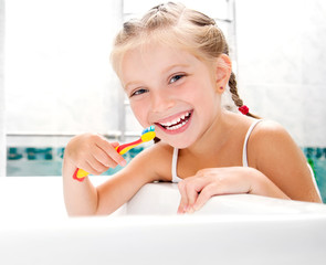 Little girl brushing teeth