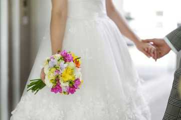 Wall Mural - Bride holding a wedding bouquet