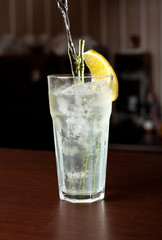 Drink with ice and lemon slice close-up