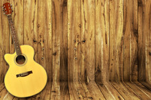 Acoustic Guitar On Wood Background
