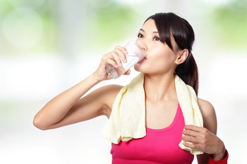 Poster - young woman drinking water after sporting