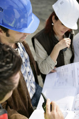 Wall Mural - Foreman and colleagues working on-site