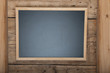 Blackboard on wooden background