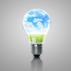 Electric light bulb and blue sky inside it