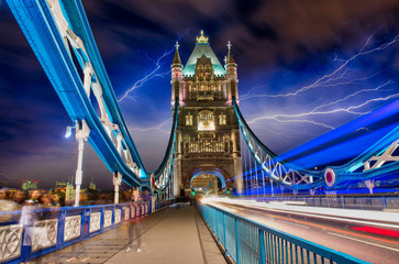 Poster - Light trails in Tower Bridge Road at night with storm