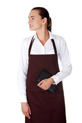 Attractive young waitress with notebook in hand