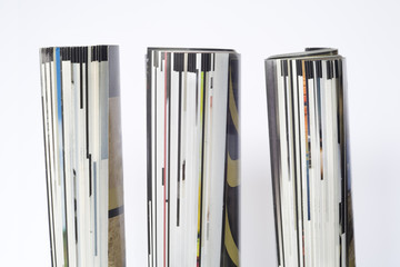 rolled up magazines, isolated, close up